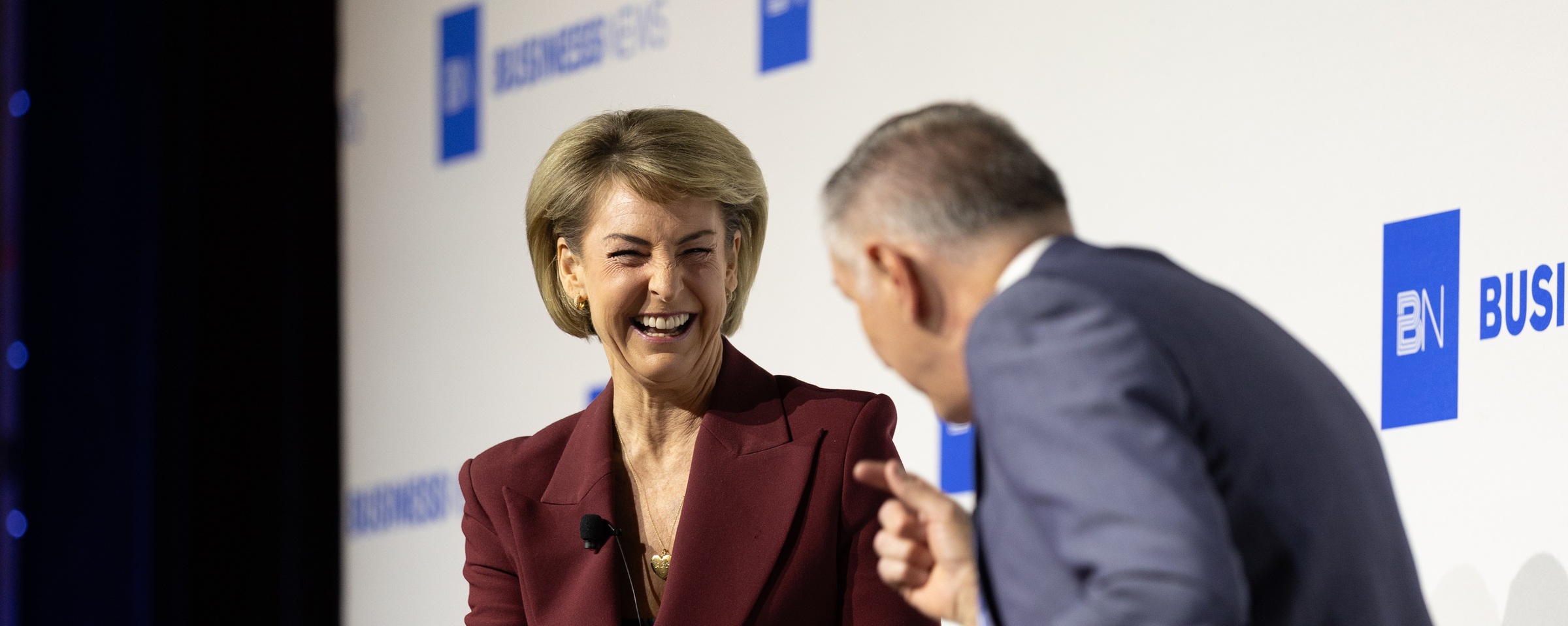 Michaelia Cash laughing during a Business News Politics & Business breakfast conversation